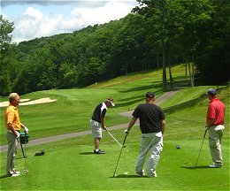 Four golfers on the green
